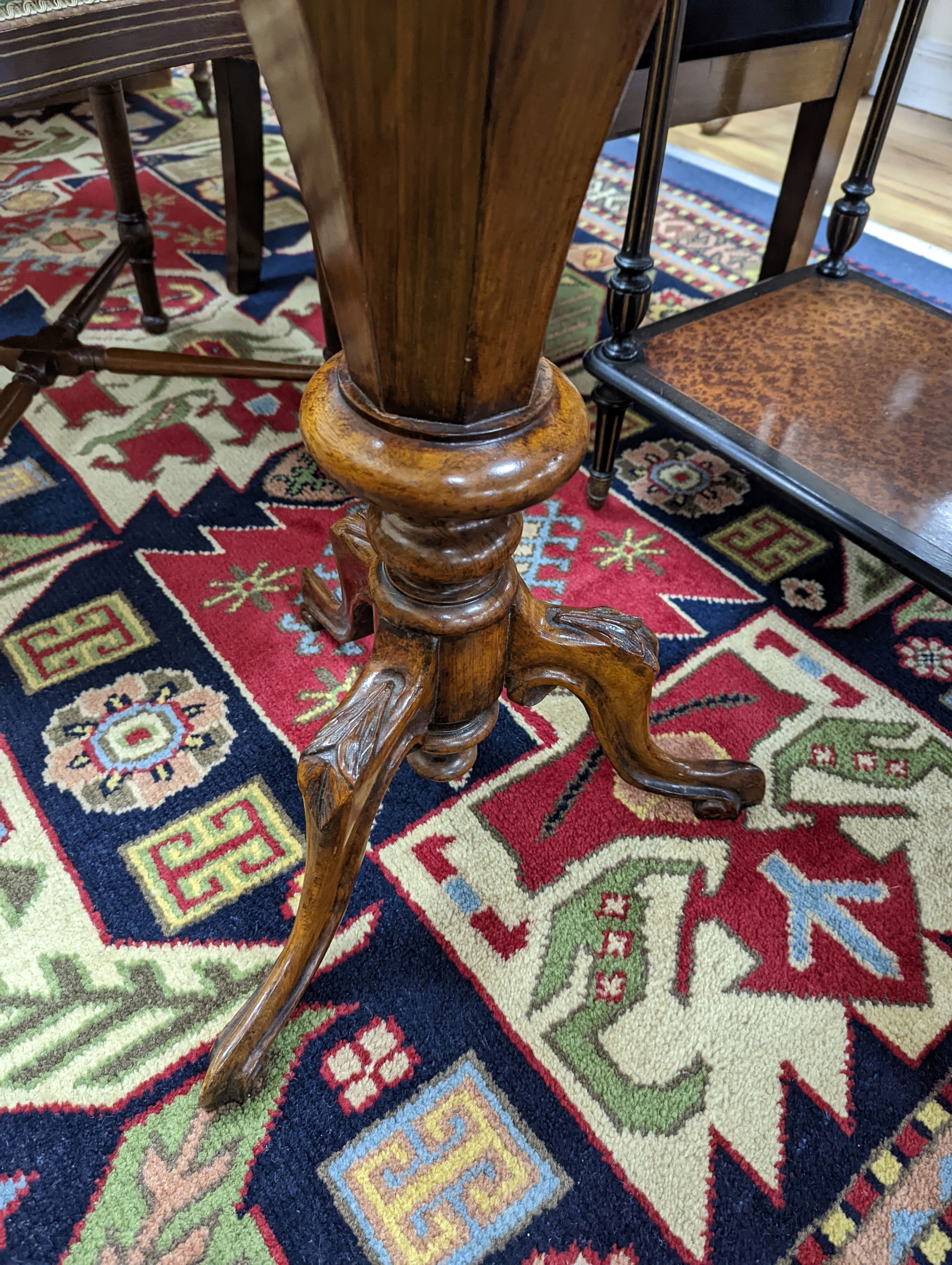 A Victorian octagonal walnut trumpet work table, width 42cm, height 73cm